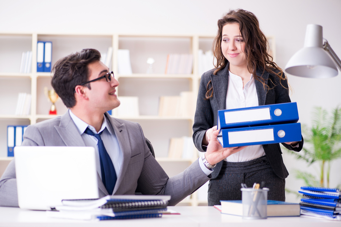 Businessman Asking for Paperwork from His Assistant Secretary