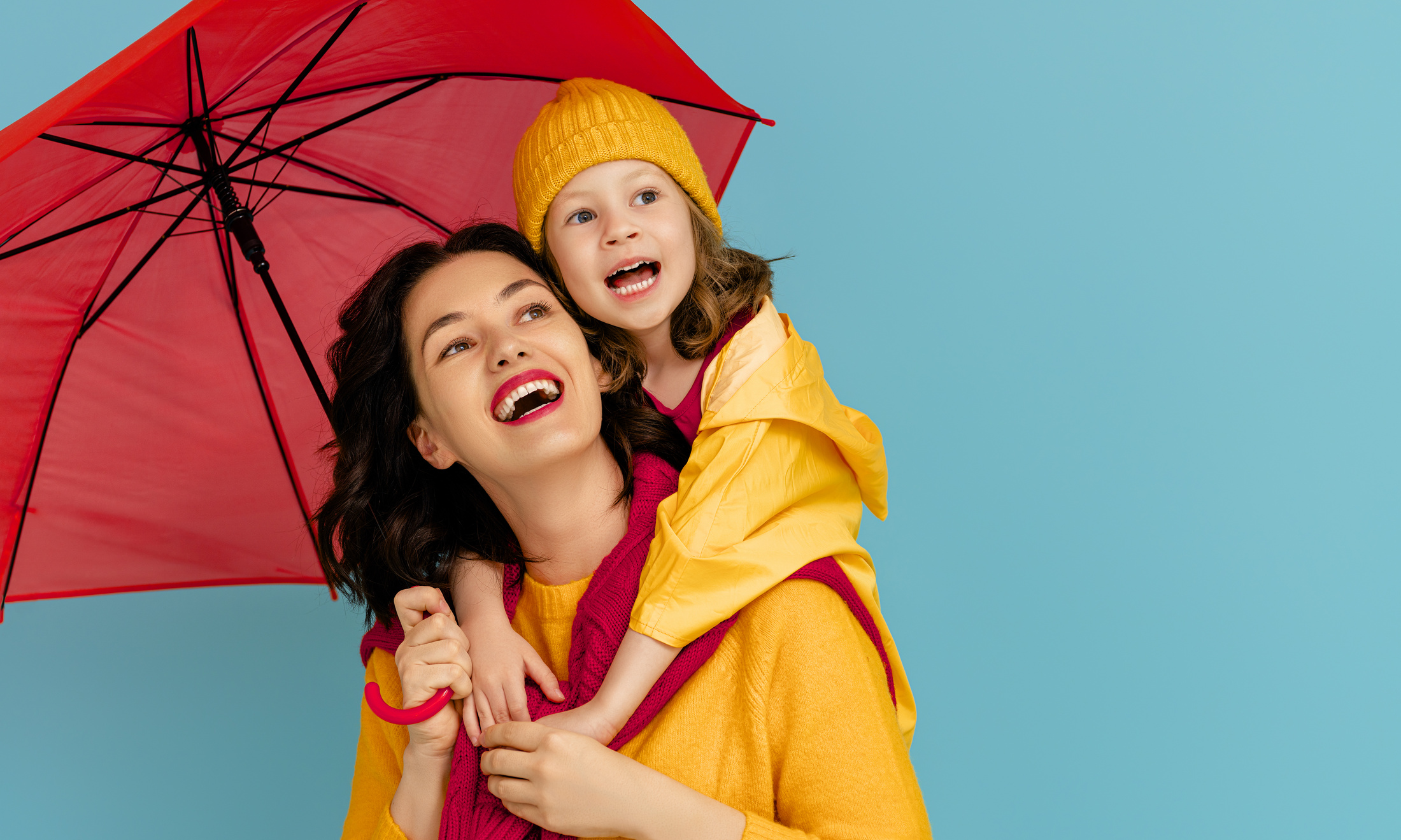 Family with red umbrella